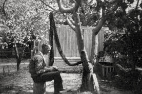 Ernest Dunshea making camouflage net at Acton cottage no. 4