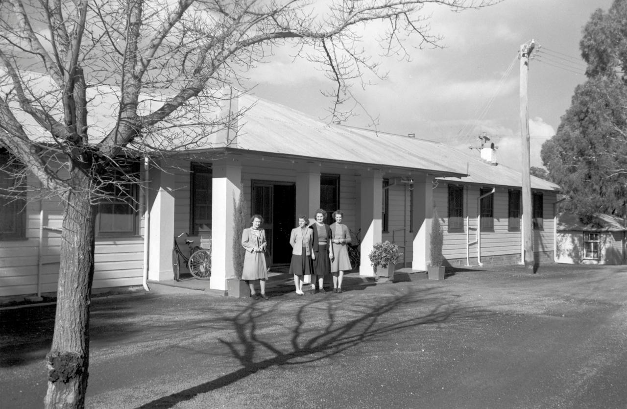 Women in front of Acton Guest House