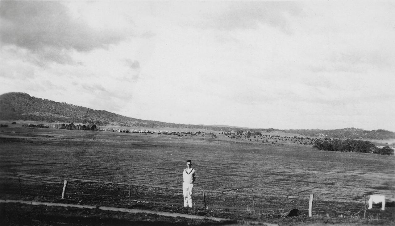 Frank Waight in front of Acton flats