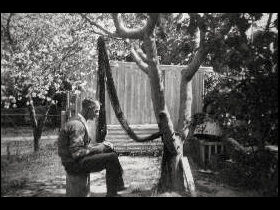 Ernest Dunshea making camouflage net at Acton cottage no. 4 Ernest Dunshea making camouflage net at Acton cottage no. 4