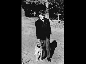 Billy Johnston outside riding school stables